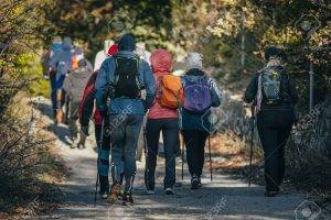 group athlete with sticks to walk started